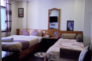 Voodi või voodid majutusasutuse Hotel Shree Tara toas