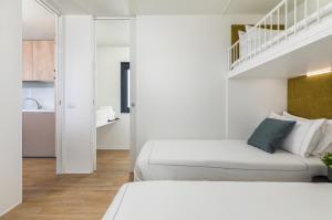 Posteľ alebo postele v izbe v ubytovaní Arena Stupice Camping Homes + 22 fotografií