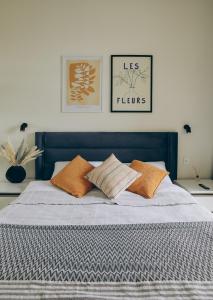 a blue bed with two pillows on top of it at Melissa Park Baku in Baku