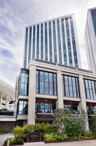 an office building with a lot of windows at Hilton Yokohama in Yokohama
