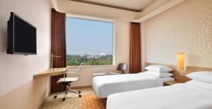 TV a/nebo společenská místnost v ubytování Fairfield by Marriott Chennai Mahindra World City