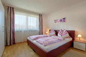 Postel nebo postele na pokoji v ubytování Alpenchalets Wilder Kaiser