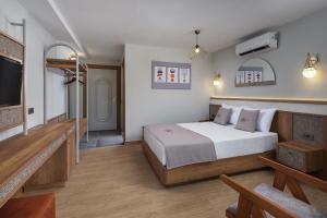 Postel nebo postele na pokoji v ubytování Monk Resort Hotel Beldibi + 23 fotografií