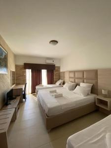 Postel nebo postele na pokoji v ubytování Imperial Hotel