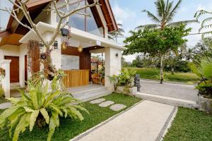 Κήπος έξω από το Pelana Ubud Villa