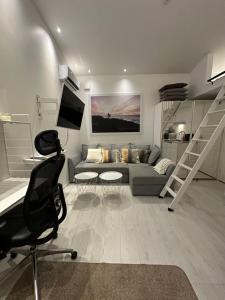 Televisyen dan/atau pusat hiburan di Little house by the beach