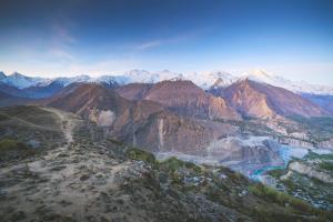 an aerial view of a mountain range with glaciers at Adventure Touristik in Karimabad Hunza
