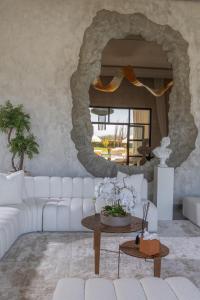 a living room with a white couch and a table at Yin Hotel & Spa in Marrakesh