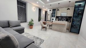 a living room with a couch and a table at Place for comfortable life in Yerevan