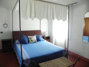 A bed or beds in a room at Agriturismo Poderi Minori