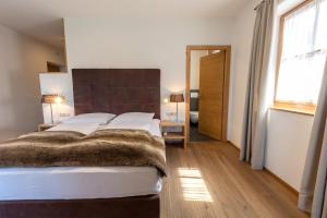 Ein Bett oder Betten in einem Zimmer der Unterkunft Der Unterwirt Guesthouse and Restaurant