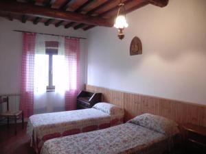 A bed or beds in a room at Agriturismo Poderi Minori