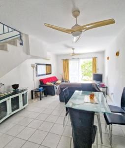 a living room with a couch and a ceiling fan at Viktoria Houses Anarita in Anarita