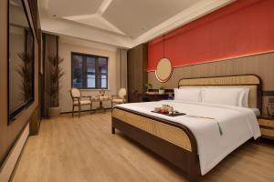 Postel nebo postele na pokoji v ubytování CiQiKou Fog Villa