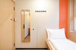 Beijing Xiaoding Hotel客房内的一张或多张床位