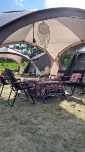 Фотография из галереи Glamping De Mangol Jogja в городе Wanujoyo +7 фотографий