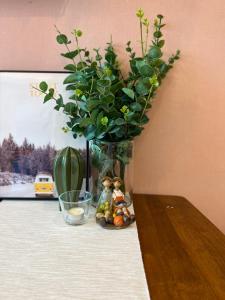 a vase with a plant sitting on a table at The Robertson Bukit Bintang by Wowhome in Kuala Lumpur