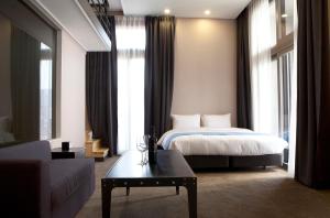 Voodi või voodid majutusasutuse S Stay Dongtan Hotel toas