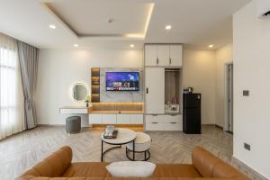 a living room with a couch and a table at RAINBOW Motel in Phú Quốc