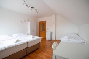 Posteľ alebo postele v izbe v ubytovaní Amenity Apartmány Perná