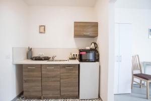 Kuchyňa alebo kuchynka v ubytovaní Amenity Apartmány Perná
