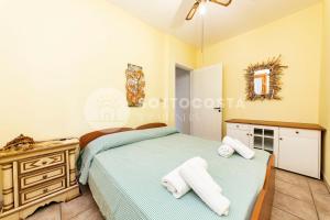 En eller flere senge i et værelse på Conchiglia d'Oro