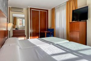 Postel nebo postele na pokoji v ubytování Torreluz Centro + 37 fotografií