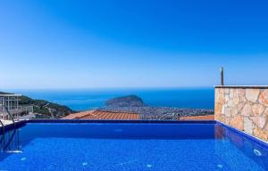 a swimming pool with a view of the ocean at Qoople Villa Tepe with infinity pool and panoramic view in Alanya