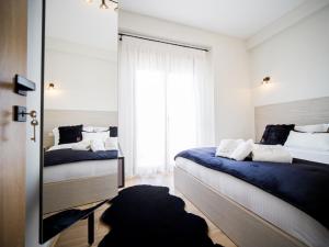Postel nebo postele na pokoji v ubytování Divino Inn