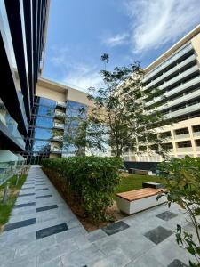 a large building with a park in front of it at Luxury 1BR Apartment in NYU Saadiyat - Furnished in Abu Dhabi