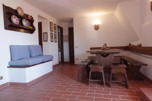 a living room with a blue couch and a table at La Casa di Betta in Marcelli