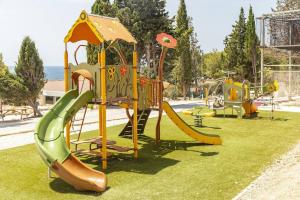 a playground with a slide at Camping Lou Soulei 218 in Carry-le-Rouet