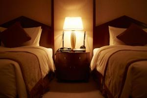 Postel nebo postele na pokoji v ubytování Imperial Hotel Osaka + 37 fotografií