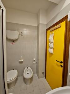 a bathroom with a toilet and a sink at Il posto del cuore in San Feliciano +29 photos