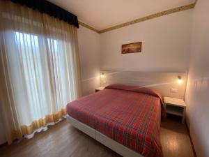 Postel nebo postele na pokoji v ubytování Hotel International