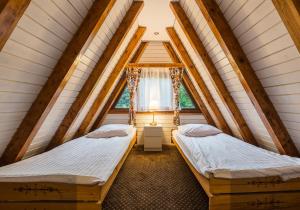 Posteľ alebo postele v izbe v ubytovaní POŁONINY Resort + 37 fotografií