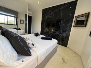 a bedroom with a king sized bed and a shower at Only You in Sidi Daoud