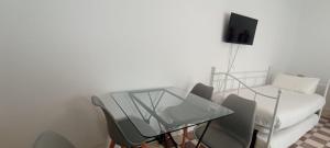 Telewizja i/lub zestaw kina domowego w obiekcie Casas y Patios de Sevilla