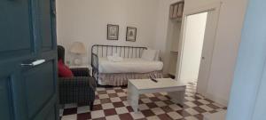 Łóżko lub łóżka w pokoju w obiekcie Casas y Patios de Sevilla