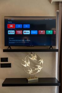 A television and/or entertainment centre at Illusion Suites