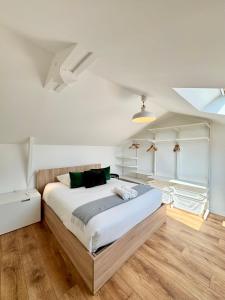 a bedroom with a large bed in a room at La Maison Diderot, Centre de Rennes in Rennes