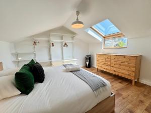 a bedroom with a large bed and a window at La Maison Diderot, Centre de Rennes in Rennes