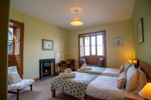 Ένα ή περισσότερα κρεβάτια σε δωμάτιο στο Brantwood Lodge