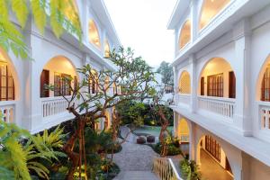 an internal view of a building with a courtyard at Kumeya Canggu Bali in Canggu