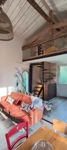 a living room with a couch and a bunk bed at Maison du Pont Canal in Agen +15 photos