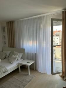 Postel nebo postele na pokoji v ubytování Apartment Leona