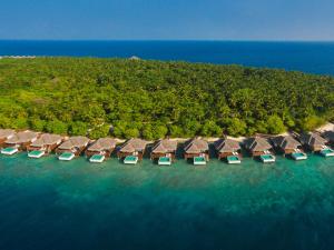 an aerial view of a resort in the ocean at Dusit Thani Maldives in Baa Atoll