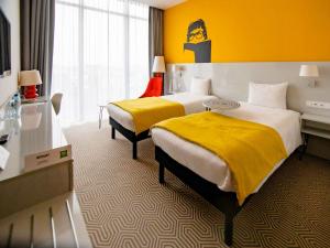 Posteľ alebo postele v izbe v ubytovaní Ibis Styles Wroclaw Centrum