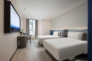Postel nebo postele na pokoji v ubytování Atour Light Hotel Hefei Hi-Tech Zone Longhu Paradise Walk