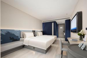 Postel nebo postele na pokoji v ubytování Atour Light Hotel Hefei Hi-Tech Zone Longhu Paradise Walk